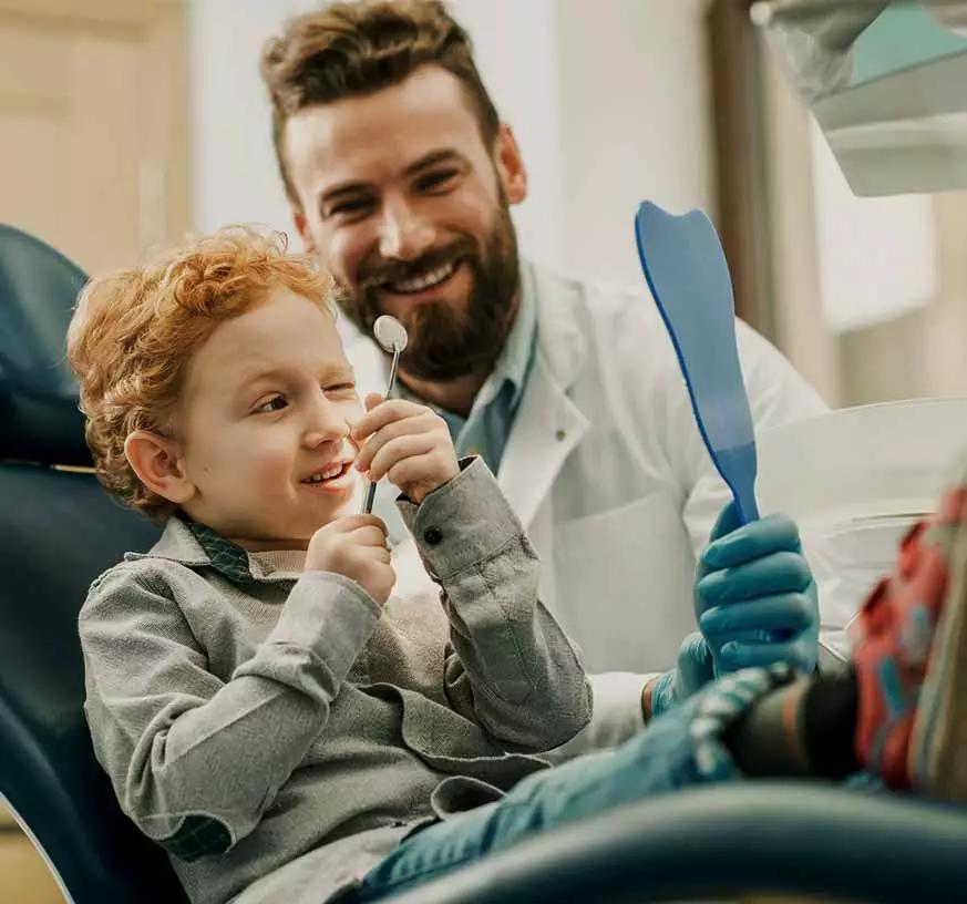 A dentist with a young patient.