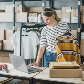 A picture of a woman working in a retail space.